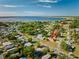 Aerial view of the home surrounded by trees in a quiet neighborhood near the lake at 4703 Benton St, Lake Wales, FL 33859