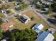 A beautiful aerial view showcases this home with solar panels and a large yard at 4703 Benton St, Lake Wales, FL 33859