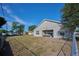 A home's backyard and covered patio feature, offering a serene space for relaxation or entertaining guests at 4703 Benton St, Lake Wales, FL 33859