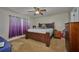Comfortable bedroom with a large bed, soft carpeting, and calming decor, perfect for relaxation at 4703 Benton St, Lake Wales, FL 33859