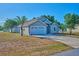 This is a nice image of the house's front exterior with a blue sky and green trees in the background at 4703 Benton St, Lake Wales, FL 33859