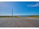 Open parking lot with a clear view of the lake in the distance at 4703 Benton St, Lake Wales, FL 33859