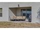 Comfortable patio furniture setup with sliding door access, ideal for outdoor relaxation at 4703 Benton St, Lake Wales, FL 33859