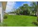 Expansive backyard with lush green grass, perfect for recreation and gardening at 4760 Holton Rd, Auburndale, FL 33823