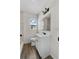 Bathroom with a white vanity, a mirror, and tiled shower at 4760 Holton Rd, Auburndale, FL 33823