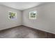 A bright bedroom with two windows and hard wood flooring at 4760 Holton Rd, Auburndale, FL 33823