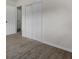Clean bedroom featuring hardwood floors and a closet at 4760 Holton Rd, Auburndale, FL 33823