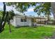 Charming home with a lush green lawn and carport at 4760 Holton Rd, Auburndale, FL 33823
