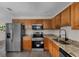 Well-lit kitchen with granite countertops and new stainless steel appliances at 4760 Holton Rd, Auburndale, FL 33823