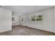 Spacious room boasting ample natural light, new flooring, and a neutral color palette at 4760 Holton Rd, Auburndale, FL 33823