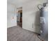 AO Smith water heater installed near door and walkway to stainless steel kitchen appliances at 4760 Holton Rd, Auburndale, FL 33823