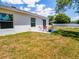 View of a patio with an outdoor seating area in the backyard of this home at 500 Rio Grande Dr, Kissimmee, FL 34759