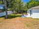 Spacious backyard with a patio, an outdoor seating area, and privacy fence at 500 Rio Grande Dr, Kissimmee, FL 34759