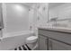 Bathroom with a tiled shower, and a vanity with white countertops at 500 Rio Grande Dr, Kissimmee, FL 34759