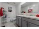 Well-lit bathroom with double sinks, ample counter space, modern fixtures, and a clean aesthetic at 500 Rio Grande Dr, Kissimmee, FL 34759
