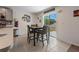 Cozy dining area with bar stool seating that is connected to the kitchen and features outdoor views at 500 Rio Grande Dr, Kissimmee, FL 34759