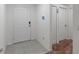 Minimalist foyer with white walls, tiled flooring, and modern door hardware at 500 Rio Grande Dr, Kissimmee, FL 34759