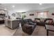 Open-concept living room and kitchen area with comfortable seating, tile floors, and lots of natural light at 500 Rio Grande Dr, Kissimmee, FL 34759