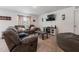 Cozy living room with a large sofa, TV, modern decor, and plush carpet for ultimate comfort and relaxation at 500 Rio Grande Dr, Kissimmee, FL 34759