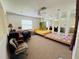 Bedroom with two twin beds, a ceiling fan, and a desk area at 502 Little Lake Ct, Winter Haven, FL 33884