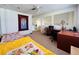 Comfortable bedroom featuring a desk and a cozy sitting area at 502 Little Lake Ct, Winter Haven, FL 33884