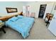 Cozy bedroom featuring a unique wood headboard and plush carpet, creating a relaxing retreat at 502 Little Lake Ct, Winter Haven, FL 33884