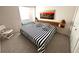 Cozy bedroom with natural wood headboard and decorative city art at 502 Little Lake Ct, Winter Haven, FL 33884