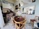 Open floor plan with a dining area featuring unique table, leading to kitchen and living room at 502 Little Lake Ct, Winter Haven, FL 33884