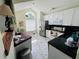 Well-lit kitchen featuring white cabinets, stainless steel appliances, and a butcher block countertop at 502 Little Lake Ct, Winter Haven, FL 33884