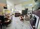 Open concept living room featuring a fireplace, neutral colored sofas, and modern flooring at 502 Little Lake Ct, Winter Haven, FL 33884