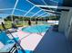 Gorgeous outdoor pool area surrounded by a screened enclosure at 502 Little Lake Ct, Winter Haven, FL 33884