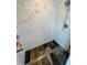 Modern shower with marble tile walls and stone look tile flooring at 502 Little Lake Ct, Winter Haven, FL 33884