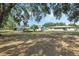 Expansive backyard with mature trees, providing ample space and natural beauty at 5829 Lake Breeze Ave, Lakeland, FL 33809