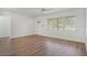Bright living room featuring modern flooring and a sunlit window at 5829 Lake Breeze Ave, Lakeland, FL 33809