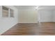 Spacious room featuring modern flooring and vintage wallpaper accent at 5829 Lake Breeze Ave, Lakeland, FL 33809
