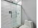 Modern bathroom with a glass-enclosed shower featuring stylish mosaic tile accents at 6014 Crystal View Dr, Orlando, FL 32819