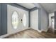 Inviting entryway featuring double doors with decorative glass and modern wood flooring at 6014 Crystal View Dr, Orlando, FL 32819