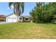 Well-manicured lawn leads to a traditional ranch-style home with an attached two-car garage at 6014 Crystal View Dr, Orlando, FL 32819