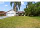 Beautiful single Gathering home showcasing lush green lawn and an attached two car garage at 6014 Crystal View Dr, Orlando, FL 32819