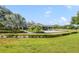 Beautiful golf course with verdant green grass, mature palms, and a lovely clubhouse at 6014 Crystal View Dr, Orlando, FL 32819