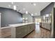 Modern kitchen island with plenty of storage and easy access to stainless steel appliances at 6014 Crystal View Dr, Orlando, FL 32819