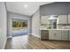 Bright kitchen featuring stainless steel appliances, gray cabinetry, and sliding glass doors to the pool area at 6014 Crystal View Dr, Orlando, FL 32819