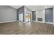 Open living room with fireplace and a seamless flow to the outdoors at 6014 Crystal View Dr, Orlando, FL 32819
