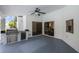 Covered outdoor patio featuring a built-in BBQ, mini fridge and counter space for entertaining at 6014 Crystal View Dr, Orlando, FL 32819