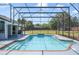 Backyard pool area featuring a refreshing pool, screened enclosure, and a spacious outdoor area at 6014 Crystal View Dr, Orlando, FL 32819
