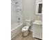 Updated bathroom with a bathtub and a white vanity at 602 Nw 1St Ave, Mulberry, FL 33860