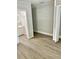A bedroom featuring modern grey floors, a closet and neutral walls at 602 Nw 1St Ave, Mulberry, FL 33860