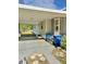 Exterior view of the home, showing the driveway, covered parking and landscaping at 602 Nw 1St Ave, Mulberry, FL 33860