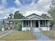 Charming home with covered parking, screened porch, and well-maintained front yard at 602 Nw 1St Ave, Mulberry, FL 33860