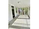 Screened-in front porch with tile flooring at 602 Nw 1St Ave, Mulberry, FL 33860